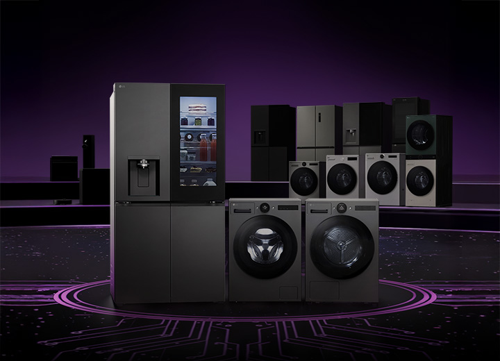 Lineup of LG home appliances including refrigerators, washing machines, dryers, and kitchen appliances displayed on a dark stage with a circuit board pattern floor