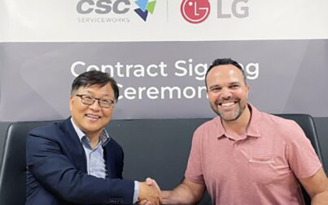 A photo of Sang-yong Kim (Executive Managing Director of HS at LG Electronics North America) and Rodrigo Castellanos (CEO of CSC) shaking hands at the contract signing ceremony