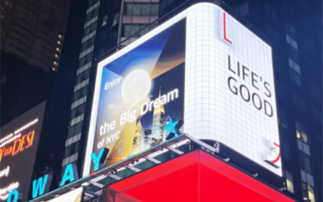 LG's digital billboard in Time Square, New York displaying an illustration of NYC with the phrase 'Life's Good'