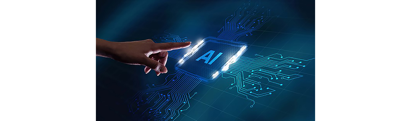 A person pointing at a semiconductor with AI printed on it. 