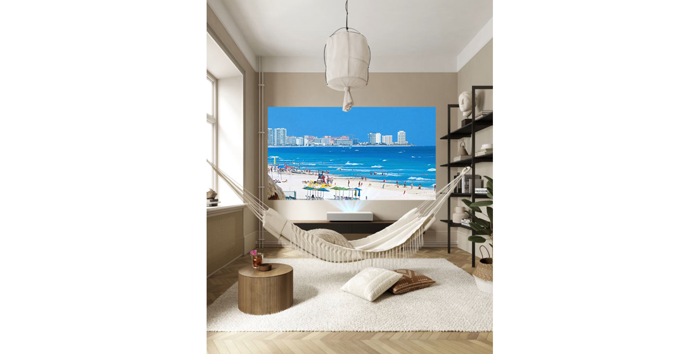 A unique relaxing space at home boasts a hammock and the LG Cine Beam Projector which is displaying clear and vibrant images of a beautiful coastal city on the far wall.