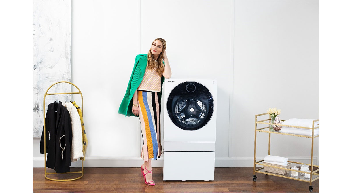 Olivia Palermo is watching the LG SIGNATURE OLED R TV, positioned in the living room