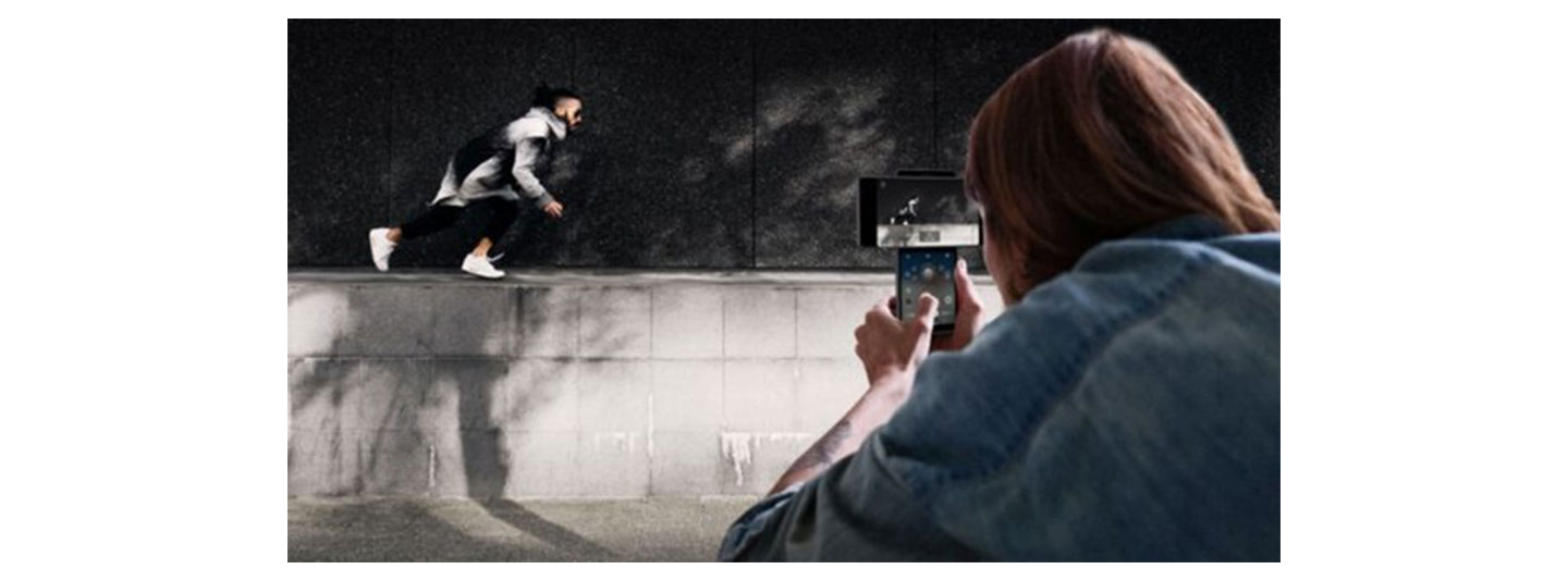 Someone taking a video of their friend doing parkour using LG Wing’s Gimbal Motion Camera to stabilize the picture