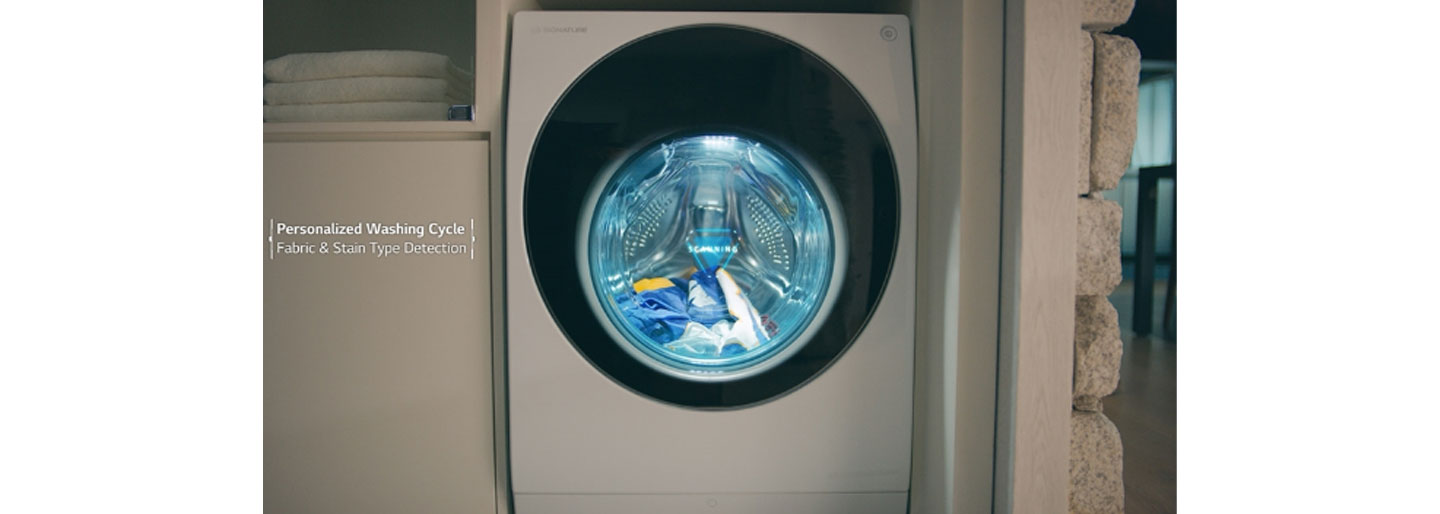 A front view of the LG SIGNATURE TwinWash washing machine running its Personalized Washing Cycle and Fabric & Stain Type Detection functions