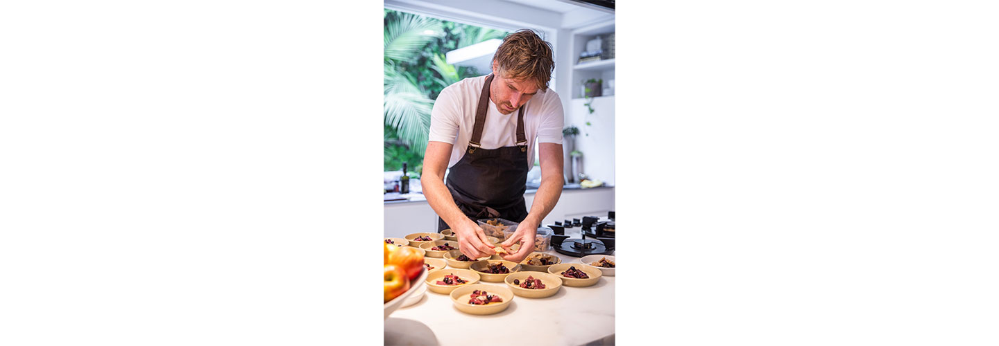 Chef Darren Robertson making the finishing touches to his dishes at Australia’s LG SIGNATURE Home