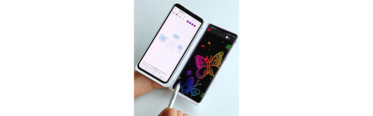 A person using LG VELVET and Dual Screen to edit a diagram on one screen while doodling colorful butterflies on the second screen