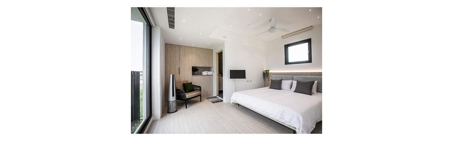 Bedroom of HA House Summer decorated with LG StanbyME and LG PuriCare AeroTower