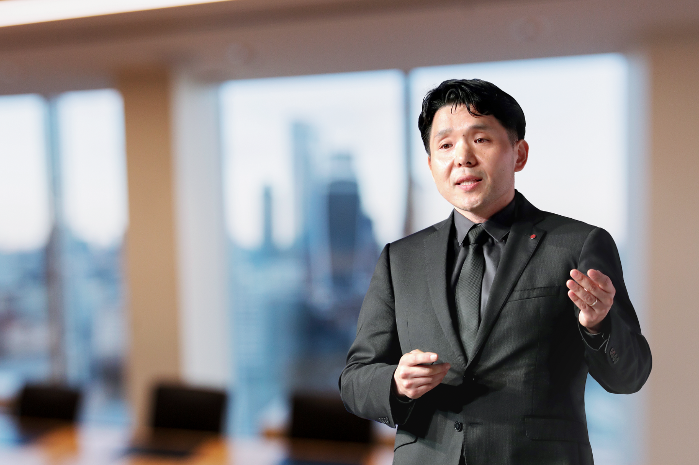 KM Ahn, head of the Design Laboratory, LG Media Entertainment Solution Company at LG Electronics, is speaking with a blurred background.