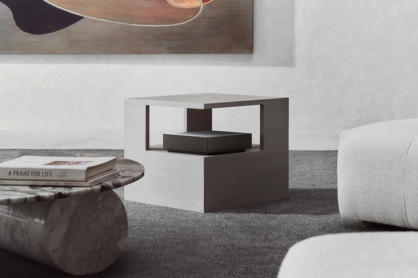 The Zero Connect Box is placed inside white a side table in a modern living room.