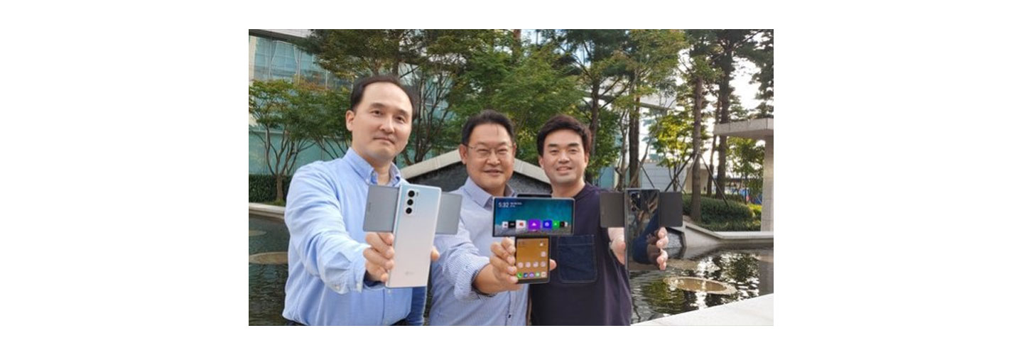 Three members of the LG MC team who worked closely on the LG WING development project hold up the device in Swivel mode while showcasing its different colors