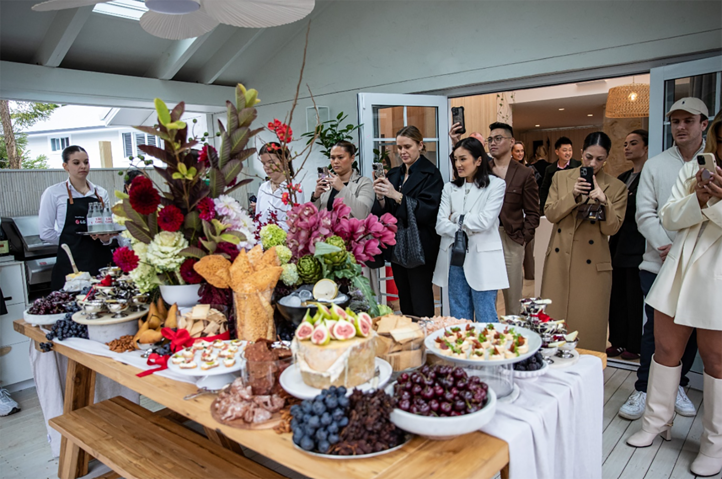 A group of people taking pictures at the event