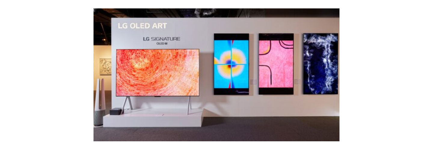 The LG SIGNATURE OLED M3 model displayed at the Hong Kong Digital Art Fair with three LG Smart TVs to its right on the wall