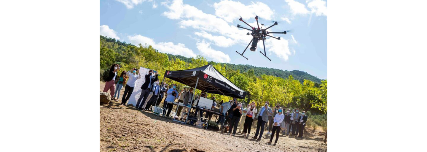 A drone flying around to gather information about the surrounding area that will help minimize the environmental impact and aid germination of the land.