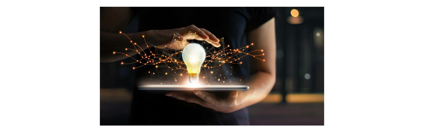 An image of a bright light bulb on top of a display device.