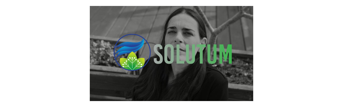 Sharon Barak, CEO of SOLUTUM, with the company logo overlapping.
