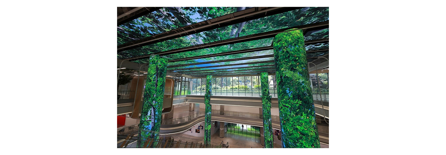 Another view of LG’s LED signage expressing images of a forest on the ceiling and pillars of Bangkok’s True Digital Park West.
