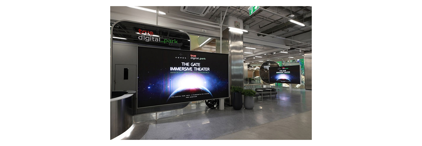 An LG screen displaying the words “The Gate Immersive Theater” at True Digital Park West.