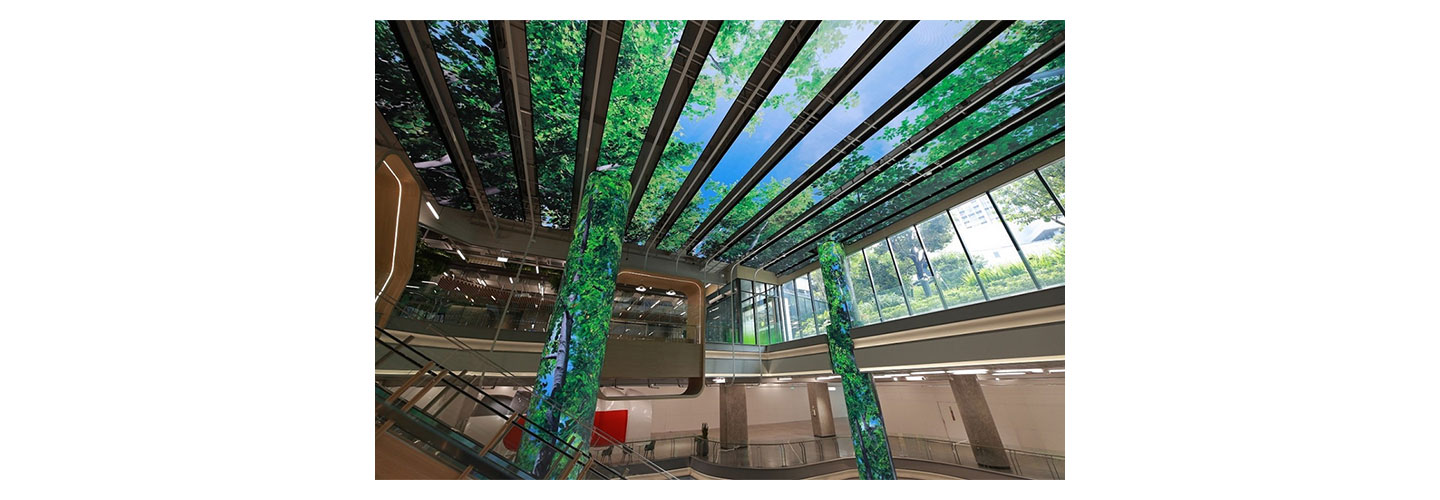 A third view of LG’s LED signage expressing images of a forest on the ceiling and pillars of Bangkok’s True Digital Park West.
