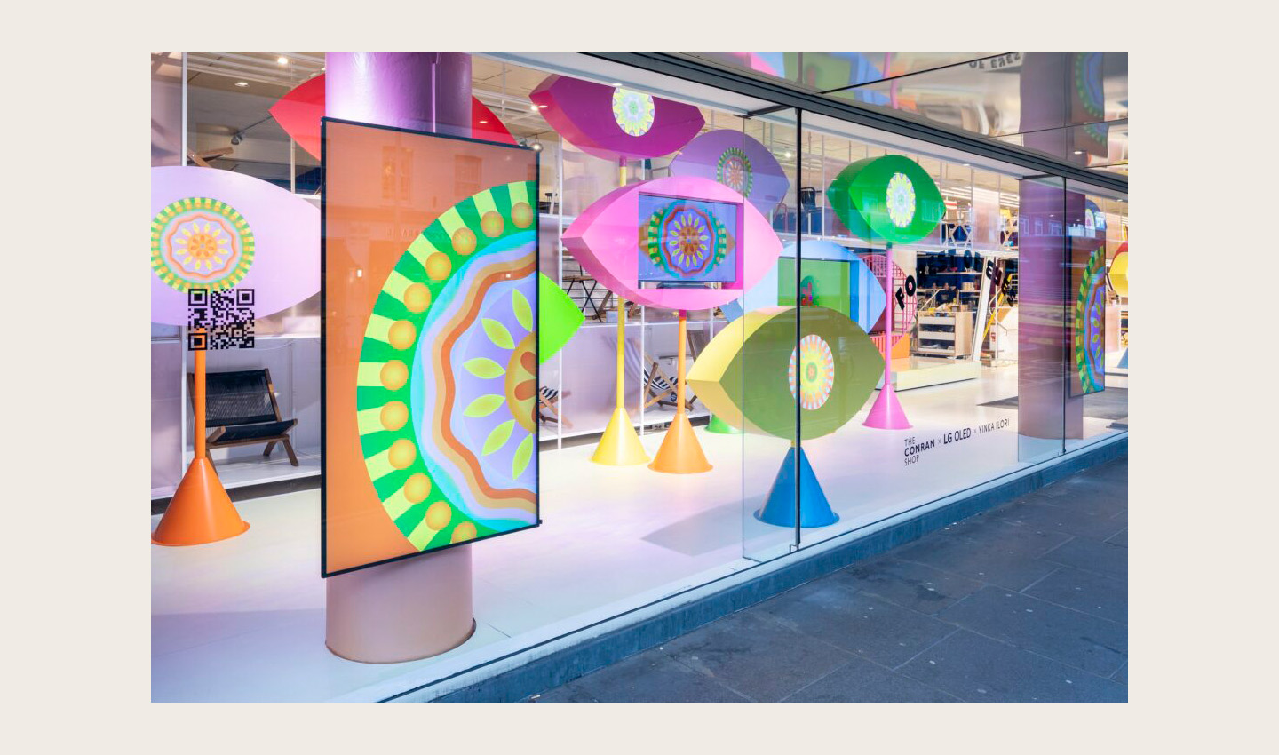 LG OLED evo TVs featured in Yinka Ilori's art installations titled 'Forest of Eyes' in the display window at the Conrad Shop