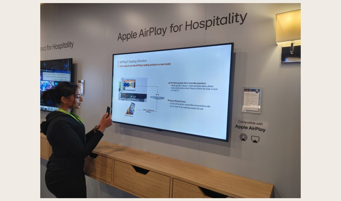 A visitor enjoying a first-hand experience of LG products at HITEC 2023
