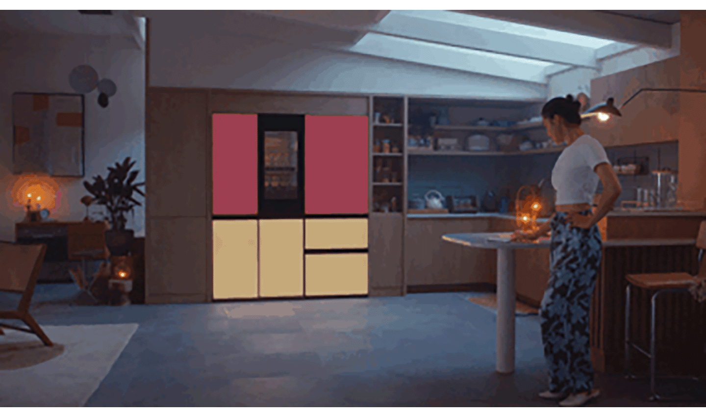 A woman is changing the color of the MoodUPTM refrigerator panel door with one touch
