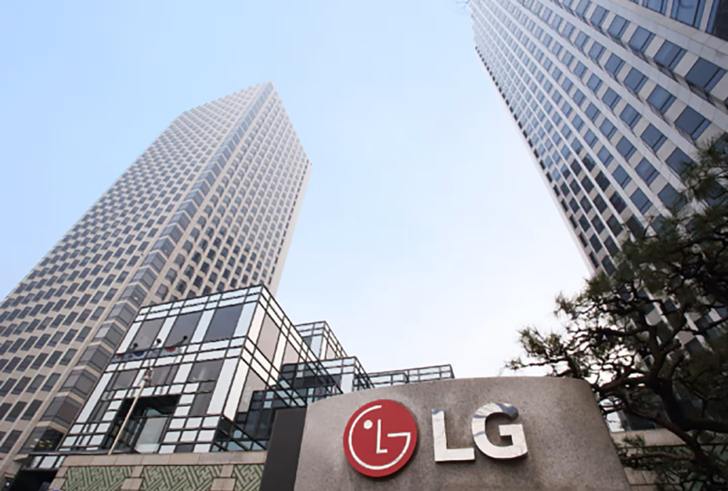 A ground view photo of the LG Twin Towers shows the buildings on a sunny day.