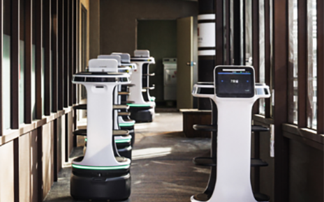 A photo of several LG's AI-driven autonomous service robots in the hallway