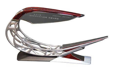 A close-up of the trophy, with the GM Innovation Award logo displayed