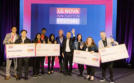 A photo of the winners of the Startup Pitch Competition standing next to each other posing for the camera with their awards