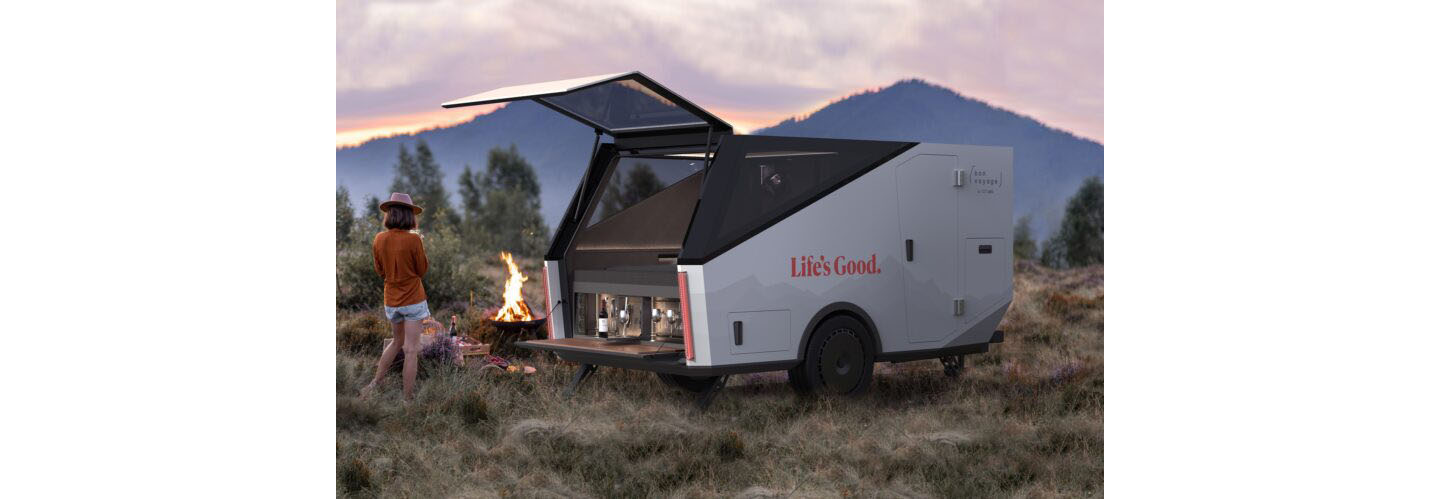 A photo of the updated version of Bon Voyage by LG Labs in the mountains with a woman standing next to it