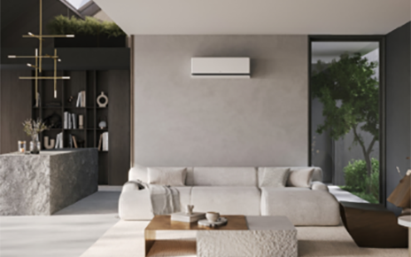 A photo of the LG DUALCOOL air conditioner set up in a living room 