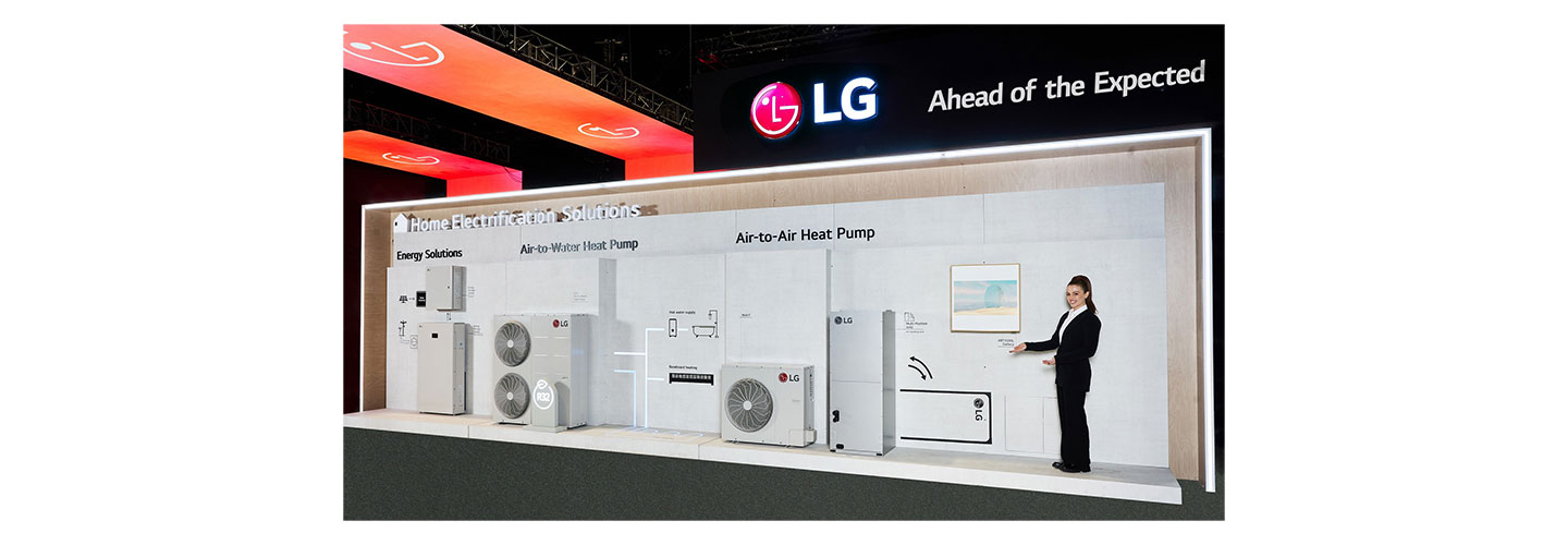 A photo of the LG Home Electrification Solutions Zone showcasing Energy Solutions, Air-to-Water Heat Pump, and Air-To-Air Heat Pump and a woman standing inside at AHR Expo 2024