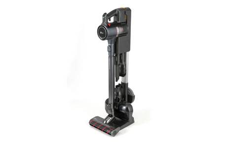 LG CordZeroThinQ A9 Stick Vacuum hooked up to its multi-type charging stand that provides space-efficient storage for the vacuum and its various nozzles and accessories.