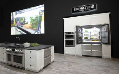 Signature Kitchen Suite built-in French Door refrigerator is displayed with other kitchen appliances in the LG booth at Kitchen and Bath Industry Show 2022