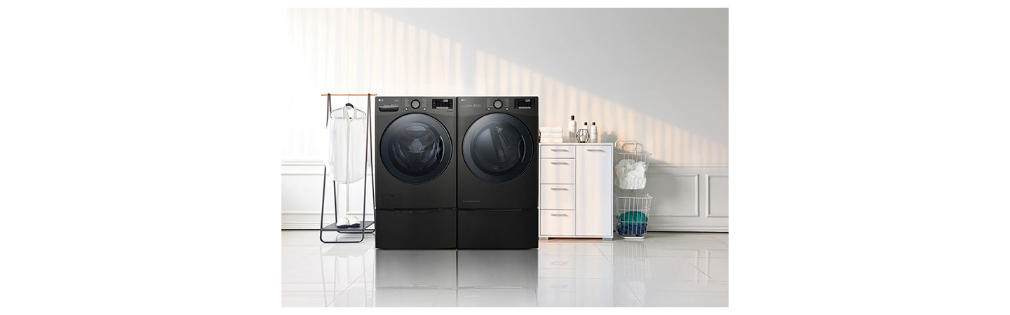 LG TWINWash™ washing machine and dryer in a laundry room