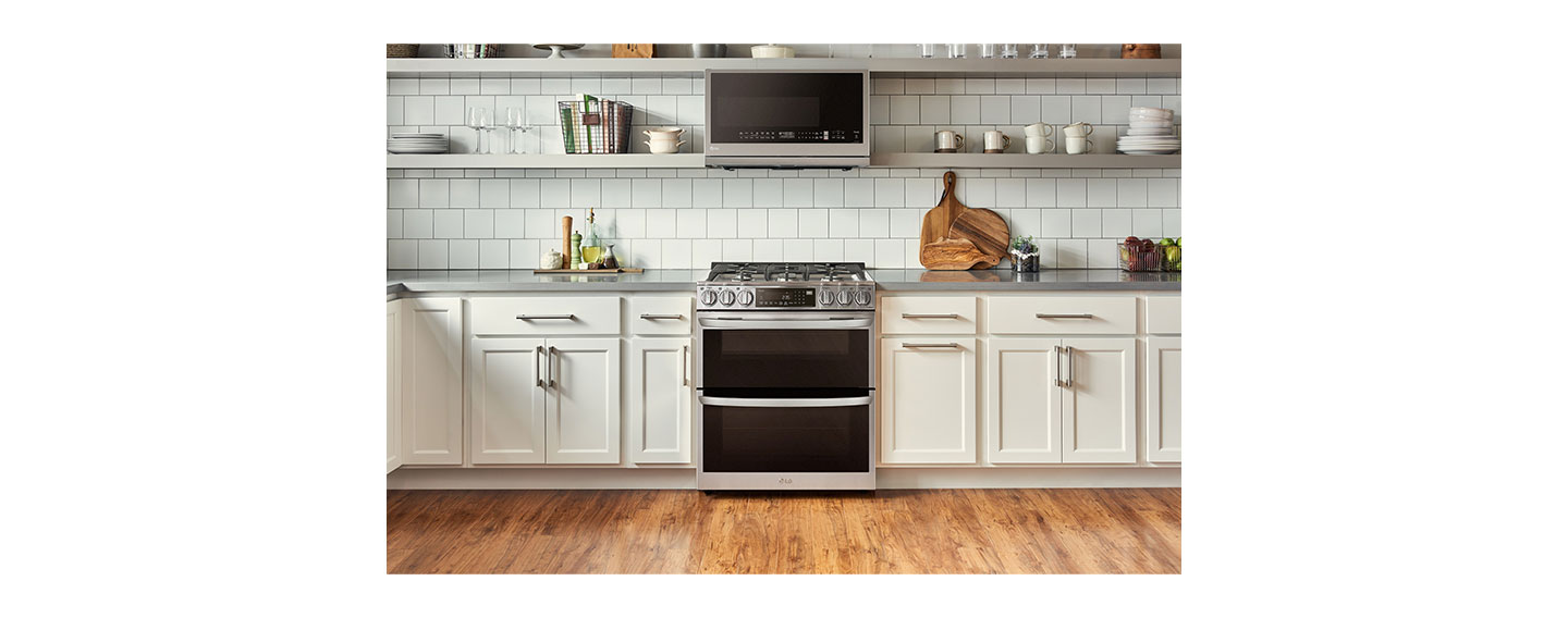 LG InstaView Double Oven Range and Over-the-Range Microwave Oven seamlessly harmonized in a bright kitchen.