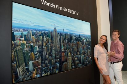 Two models look in awe at the world’s first LG 8K OLED TV displayed at IFA 2018.