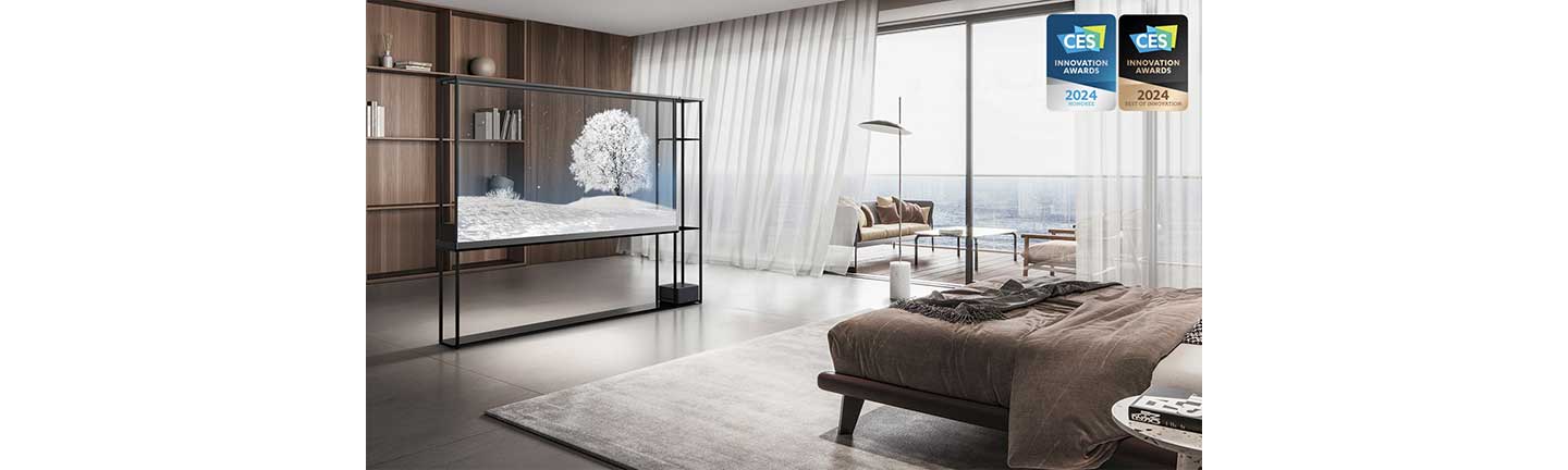 The LG OLED T displays a snowy scene in a bedroom with a bookshelf visible behind the transparent screen