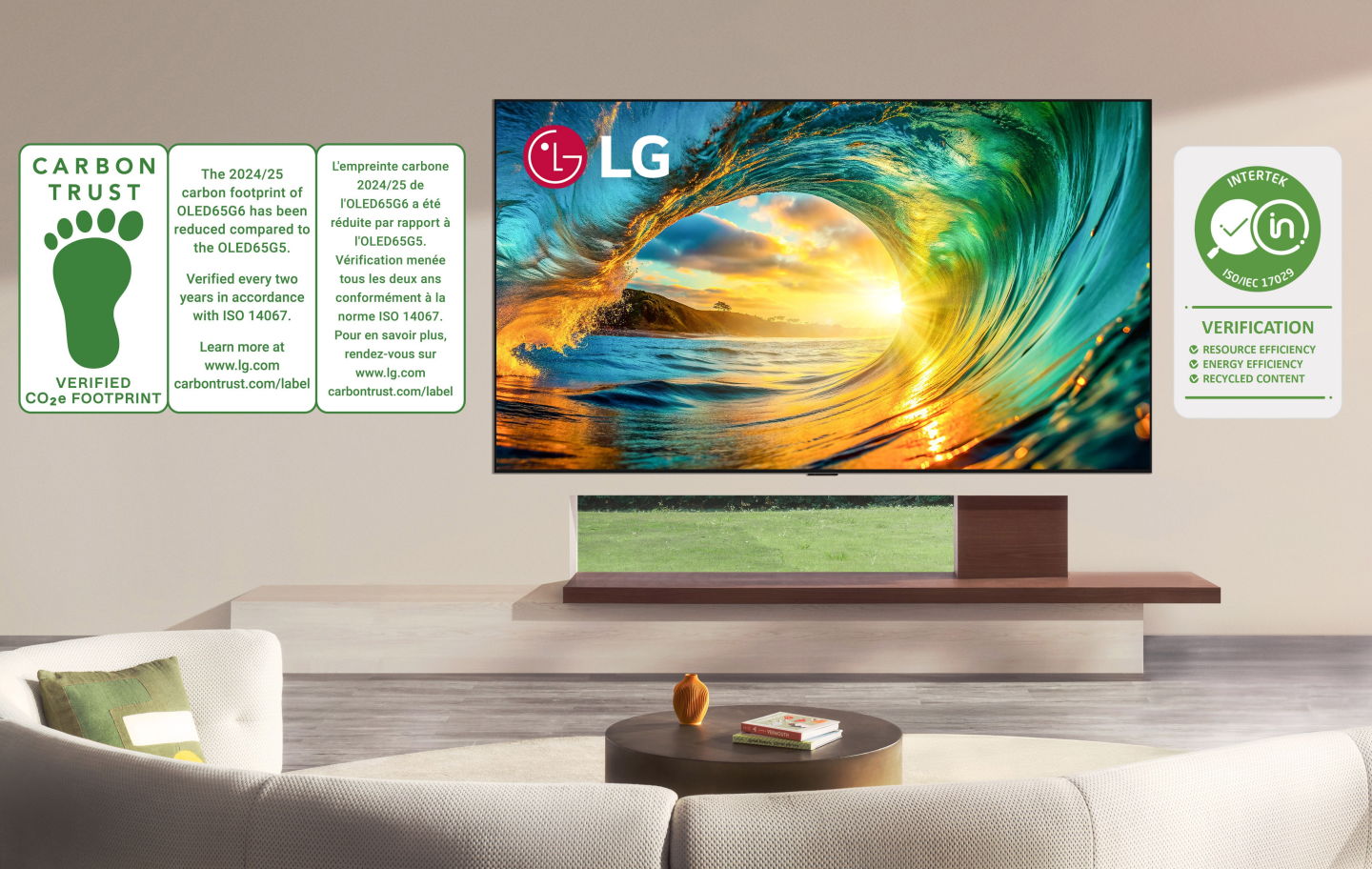 A wall-mounted LG TV displays a vibrant sunset alongside graphics of recognized sustainability certifications..