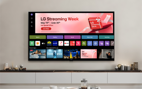A wall-mounted LG Smart TV showcases the 'LG Streaming Week' promotion on its home screen in a modern living room.