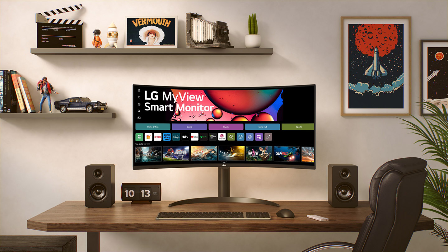 A desktop setup featuring the new LG MyView Smart Monitor with a curved design