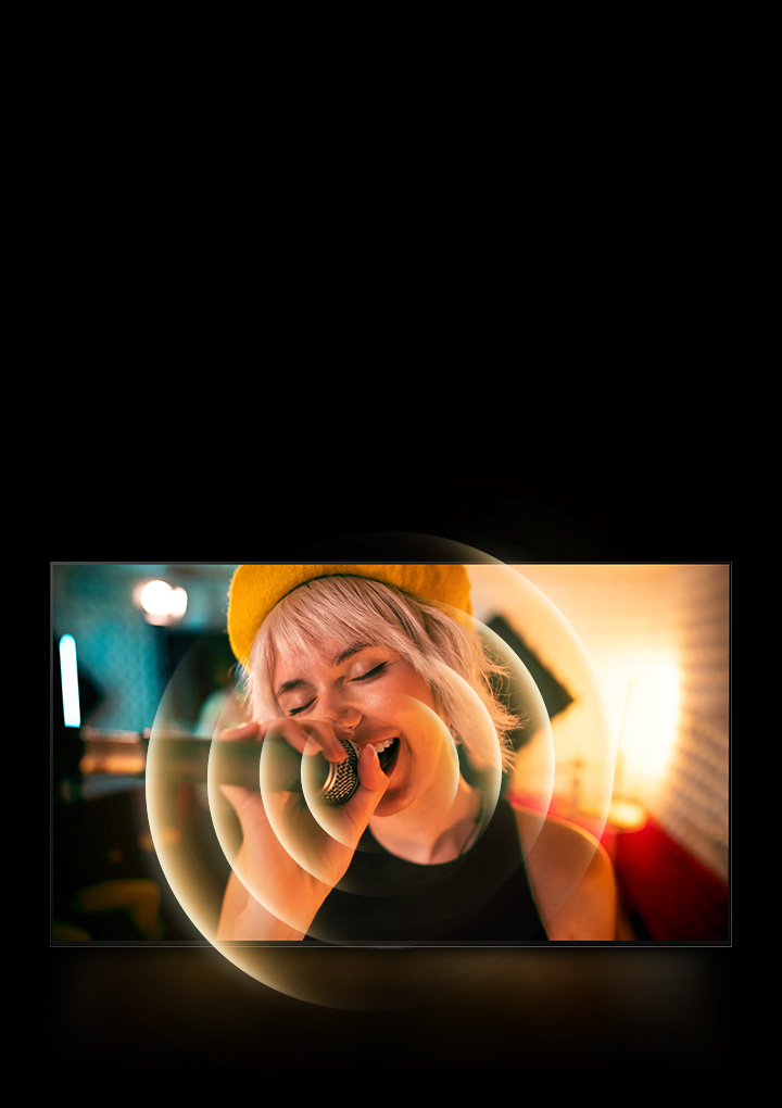 A woman singing with a microphone in her hand and orange circle graphics around her mouth to show the soundscape.