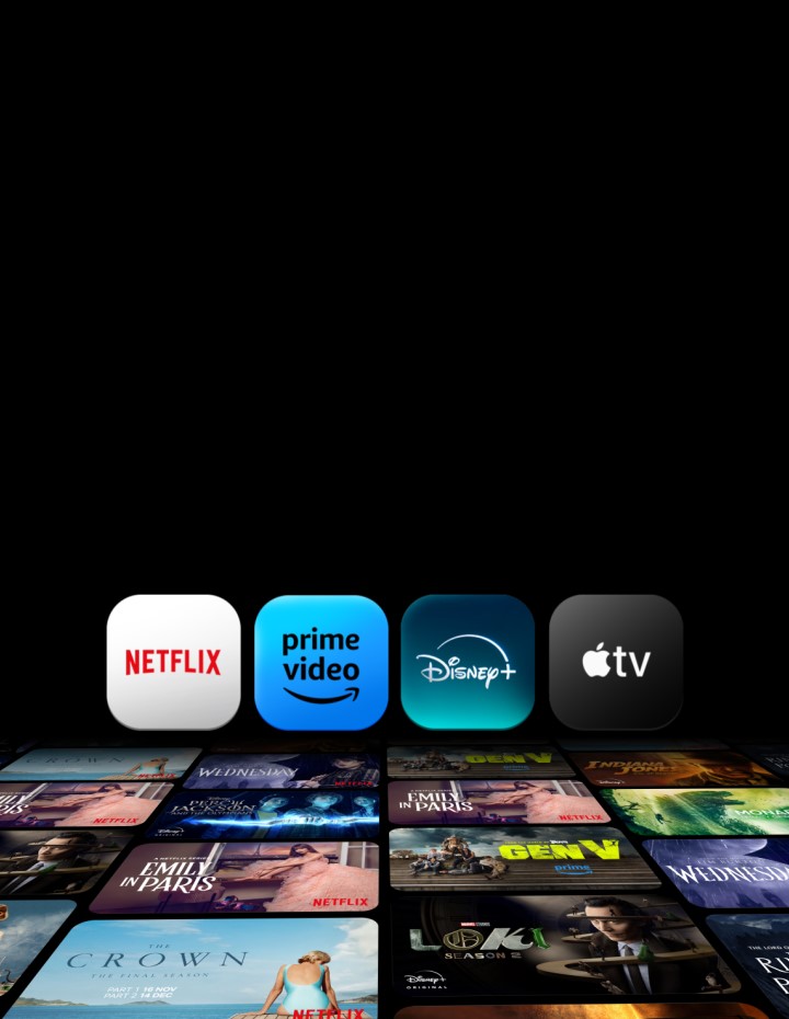 The Netflix, Prime Video, Disney+, and Apple TV app appear one by one against a black backdrop to stand side-by-side. Below them, 6 rows of posters for exclusive TV series and movies lie at an angle, each moving in different horizontal and vertical directions.