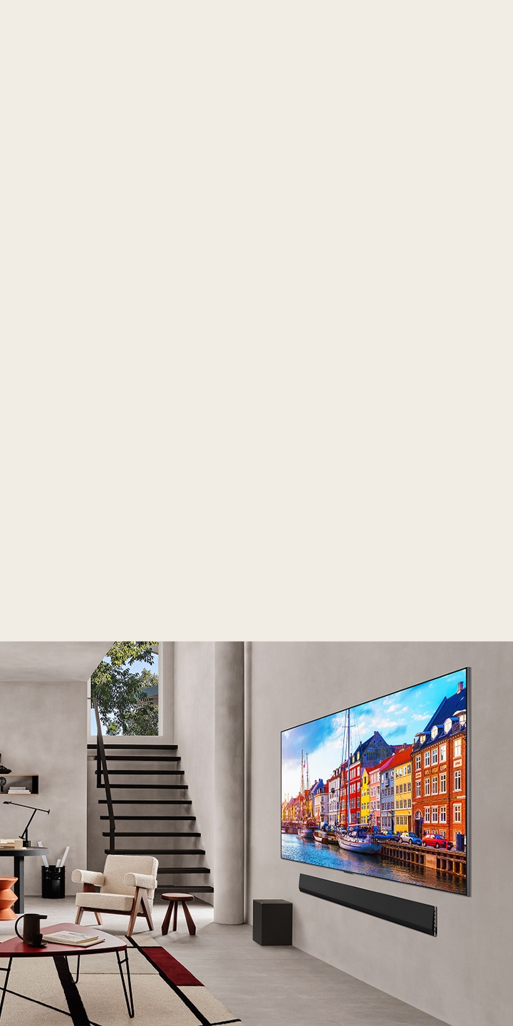 Living room with a wall-mounted LG TV and LG Soundbar.