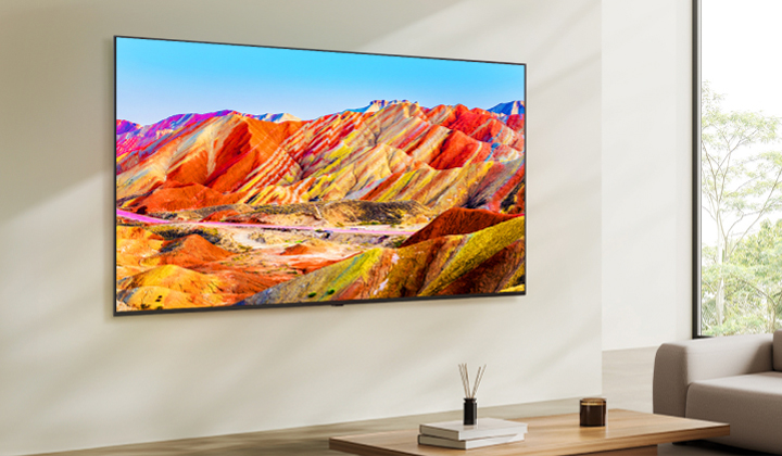LG NanoCell TV mounted on a wall. Colorful picture on its screen.