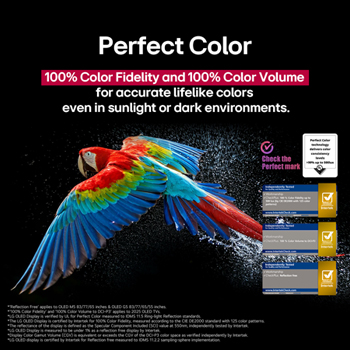 Colorful parrot in ultra-high definition against a black background. Water drops are suspended in the air all around it. The image showcases Perfect Color as each different hue on the parrot's body is vibrant and vivid. The dark background with the detailed water splashes also highlights how the screen is reflection-free. Different logo certifications from UL and Intertek are visible. These refer to its 100% Color Fidelity, 100% Color Volume, and reflection-free claim. Text is also visible, check the Perfect Color certification mark.