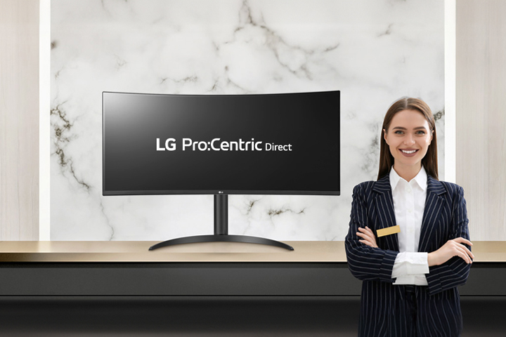 The LG Pro:Centric Direct solution text is visible on the monitor, accompanied by a smiling hotelier.