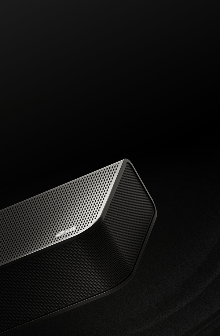 LG Soundbar is against a black backdrop reveals its design starting from the top and moving to the corner. White droplets project from the center and ends of the soundbar like a waterfall, depicting up firing sound.