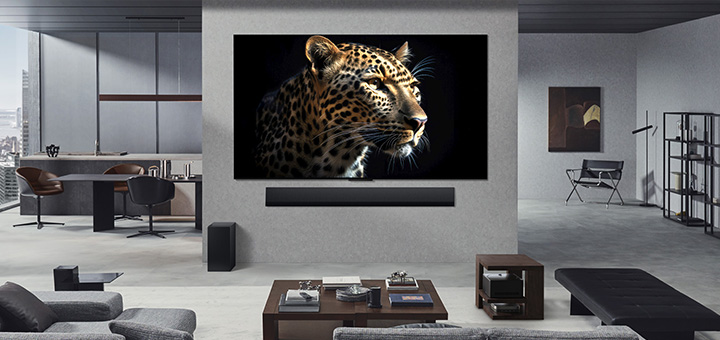 Wall-mounted LG OLED M5 TV and LG Soundbar in the living room of a classy apartment. Zero Connect Box hidden underneath a side table.