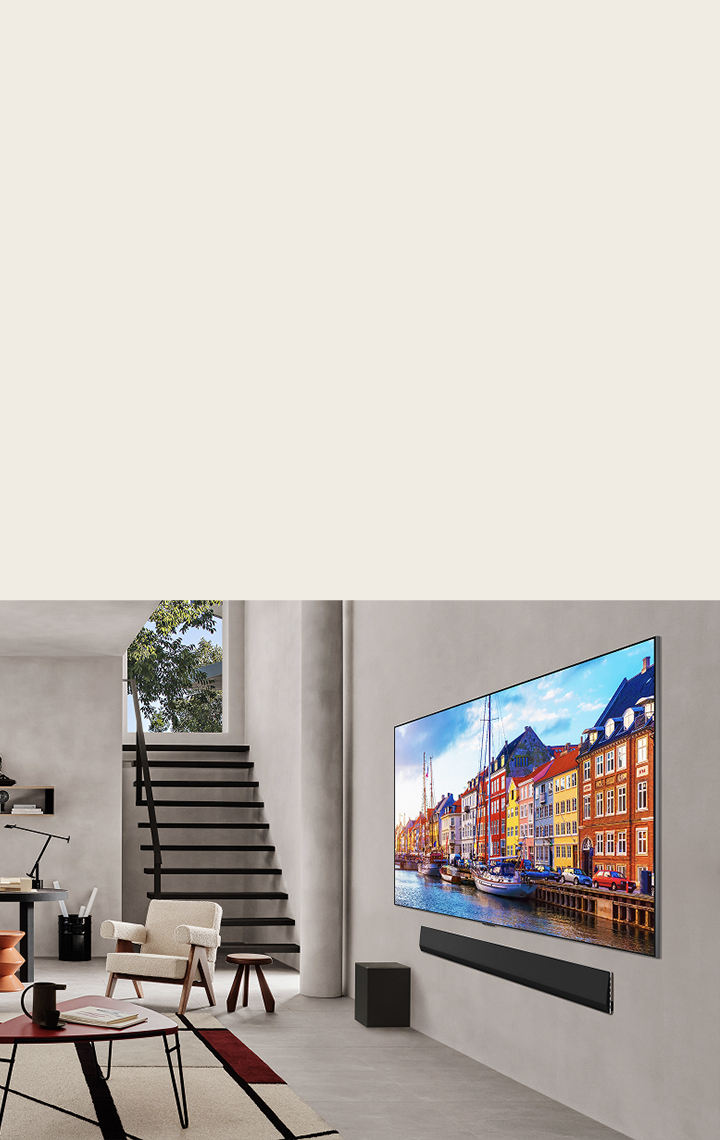 Living room with a wall-mounted LG TV and LG Soundbar.